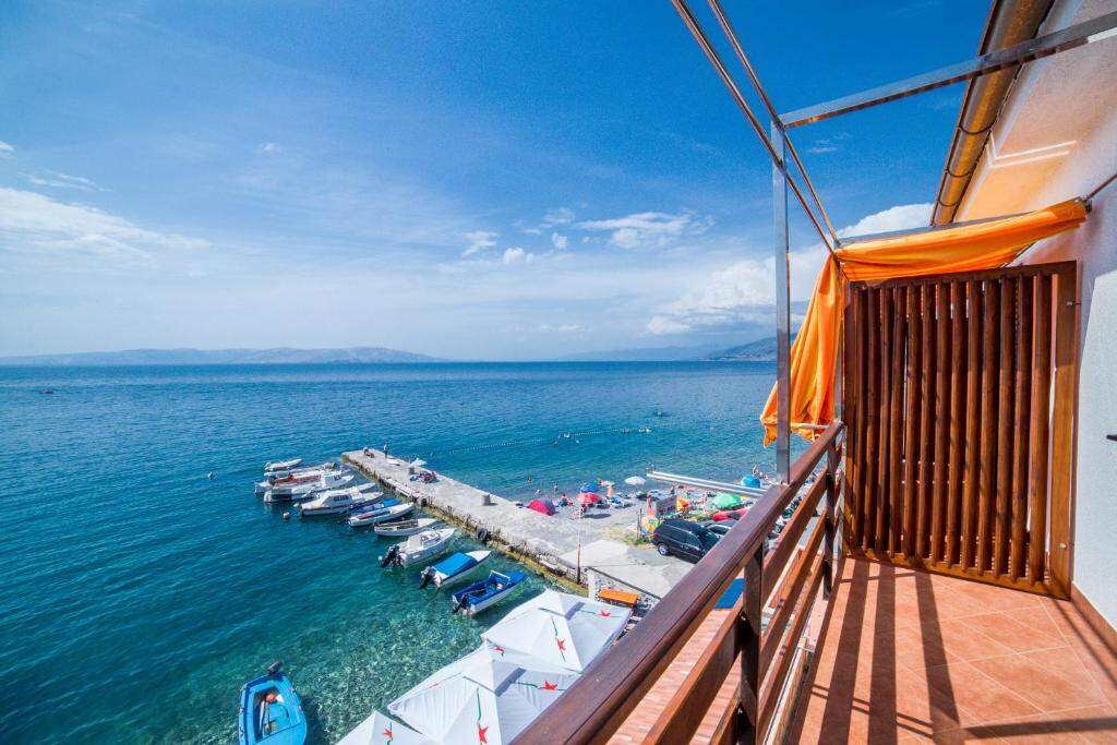 Balcony view over the pier and the Adriatic Sea in Sveti Juraj